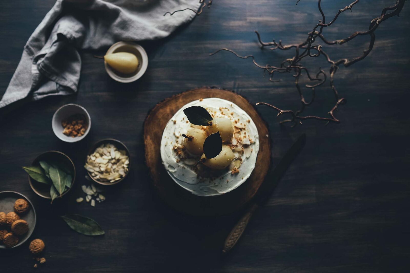 Pear and almond cake on wood slice.